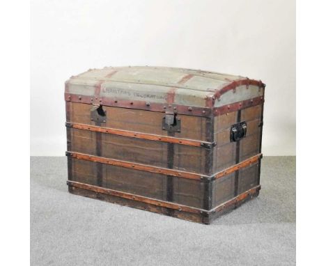 A 19th century dome top wooden bound trunk86w x 50d x 63h cm