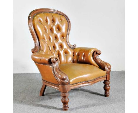 A Victorian style leather upholstered button back show frame armchair