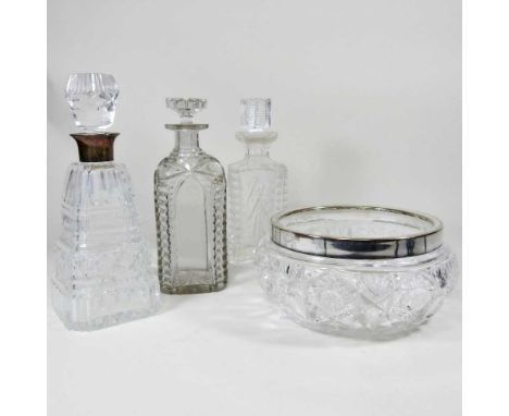 An early 20th century silver mounted cut glass decanter and stopper, Birmingham 1938, 28cm high, together with two glass deca