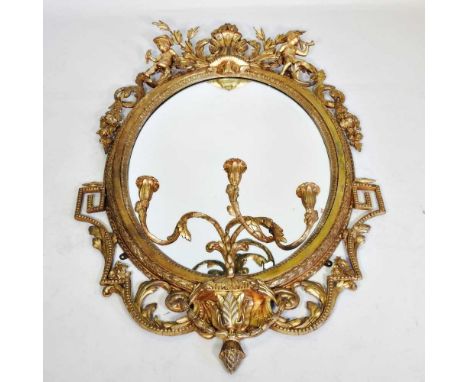 A good large 19th century carved wood and gilt gesso girandole, of oval shape, with a moulded surround, the shell and acanthu