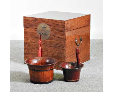 A Chinese elm trunk, 45cm wide, together with two rice bowls (3)45w x 45d x 45h cm