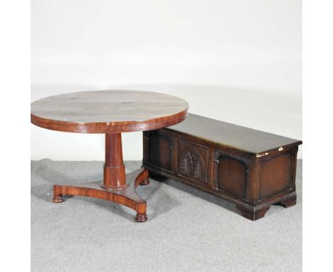 A Victorian rosewood circular dining table, 108cm wide overall, together with an oak coffer (2)108w x 106d x 71h cm