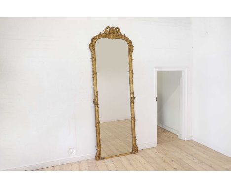 A large Louis XV-style giltwood and gesso pier mirror,late 19th/early 20th century, French, the shaped rectangular frame with