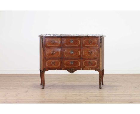 A Transitional-style kingwood and tulipwood commode,c.1900, French, the veined marble top above three long drawers, raised on