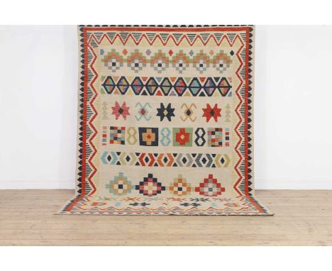 A kilim wool rug,of recent manufacture, Afghan, woven with polychrome geometric motifs to a pale ground,300 x 197cmCondition 