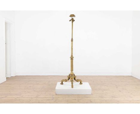 A telescopic gilt-brass floor lamp,late 19th century, the wrythen twist column stem, raised on a tripod stem with cast rococo