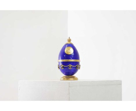 ▴ A silver-gilt and enamel egg,by Theo Fabergé and Sarah Fabergé, London 2005,titled 'The Trafalgar Egg', number 8 of 50, wit