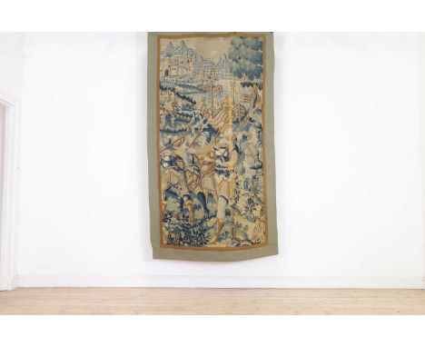 A verdure tapestry fragment,late 17th century, Flemish, worked in wools, depicting a group of soldiers brandishing ranseurs, 