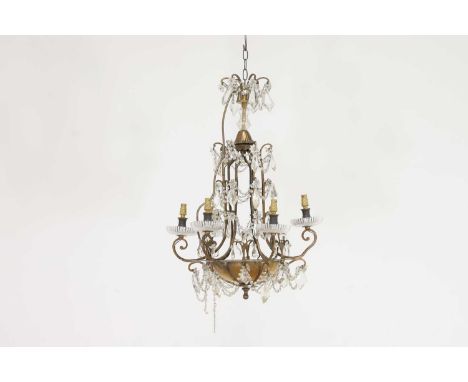 A gilt-brass and glass ceiling light in the style of Maison Baguès, 20th century, with scrolling branches suspending various 