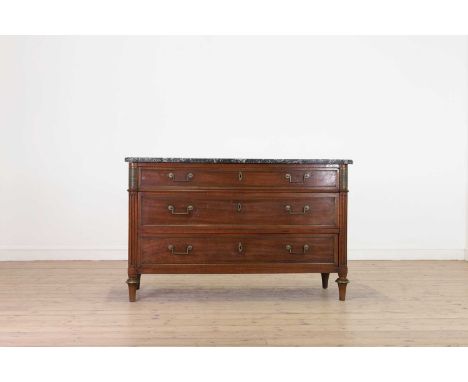 A Louis XVI mahogany commode,c.1790, French, the rectangular marble top above three long drawers, flanked by fluted columns a