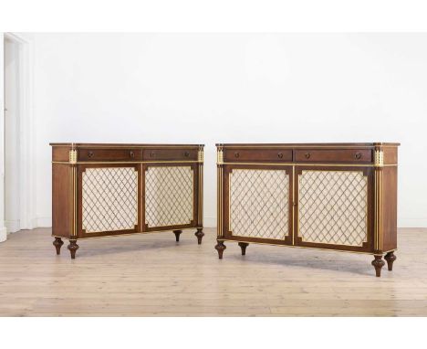A pair of Regency-style side cabinets, late 20th century, in the manner of Arthur Brett, each with twin silk-lined and wire g