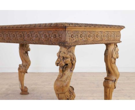 A carved pine centre table,19th century, Italian, with a Rosso Verona marble top above a guilloché-carved frieze, raised on l