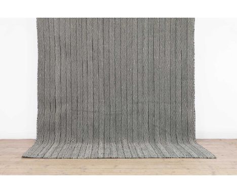 An herringbone wool carpet, of recent manufacture, woven in tones of black and white,297 x 236cmCondition ReportSome minor di