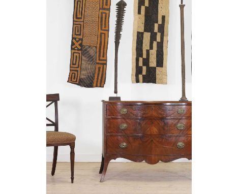 A George III mahogany serpentine commode,c.1770, in the manner of Henry Hill of Marlborough, fitted with three graduated long