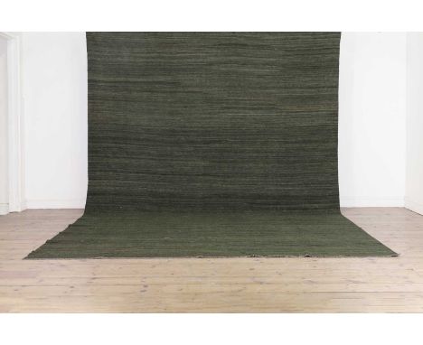 A contemporary flat-weave carpet, of recent manufacture, woven in deep green, 383 x 262cmCondition ReportOverall appears in g