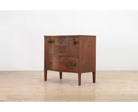A George III mahogany serpentine commode,late 18th century, fitted with an arrangement of variously shaped drawers, raised on