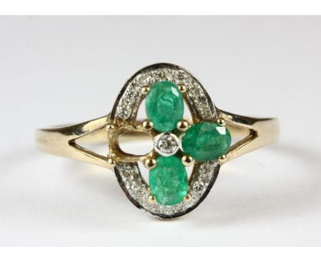 A 9ct gold emerald and diamond ring (P.5)