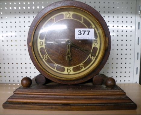 An oak mantle clock