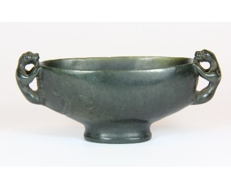 A lovely dark green spinach jade libation cup with young dragon handles W 10cm x 4.5cm x 4.5cm Est. £150 - 200