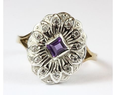 A 9ct diamond and amethyst set ring. Size N