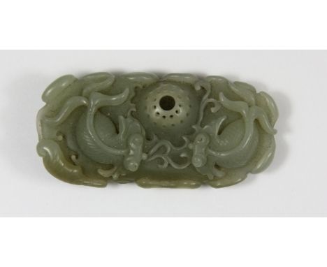 A Chinese carved celadon jade figure of fan tailed koi around a fishing basket 7cm x 3.5cm x 1.5cm Est. £120 - 150