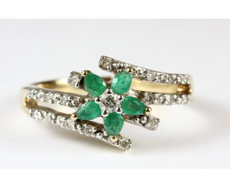 A 9ct gold emerald and diamond cluster ring (O.5)