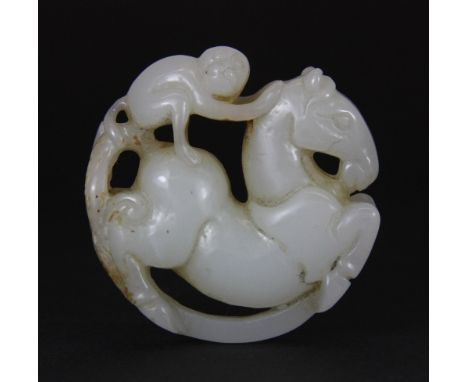 A Chinese carved mutton fat jade figure of a monkey riding a horse 5cm x 5cm x 2cm Est. £150 - 200