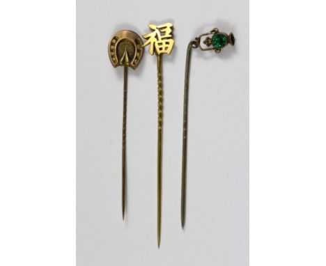 A Chinese yellow metal stick pin and 2 others