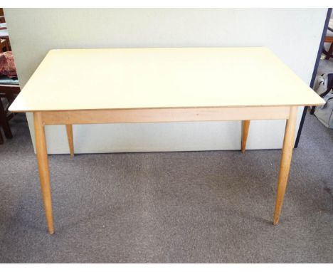 A formica topped kitchen table, 73cm high x 121cm wide x 68cm deep