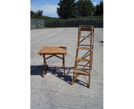 A folding garden table and a wooden step ladder