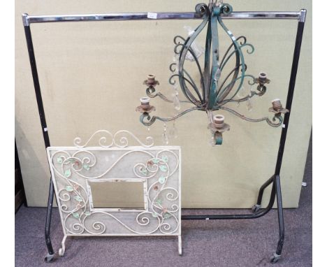 A metal pendant light fitting, a fire screen and a clothes rail