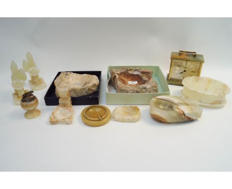 A collection of onyx and other stone items to include a pipe rest