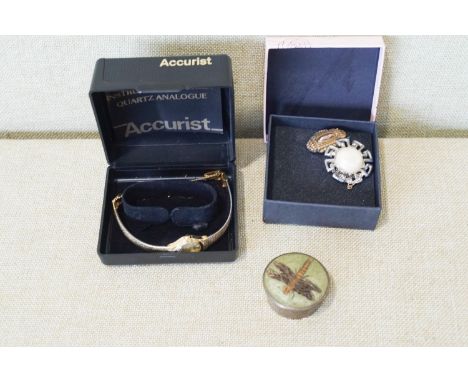 An Accurist watch, mourning brooch and other items