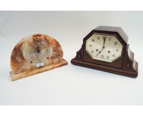 An Urgos (German) Art Deco eight day mantel clock, in oak, and a Smiths Art Deco eight day onyx clock