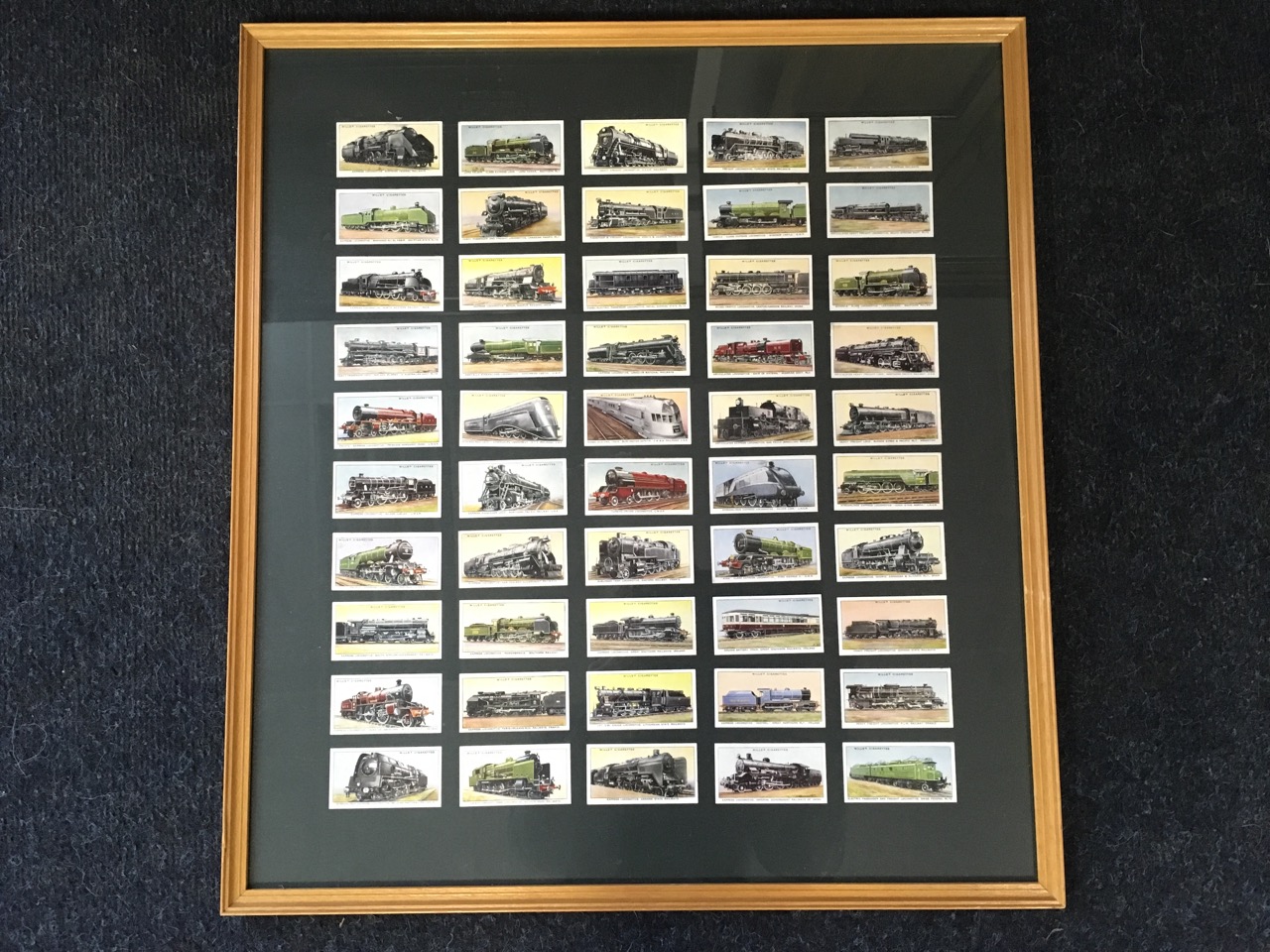 A framed set of 50 Wills cigarette cards (19.5in x 21.5in)