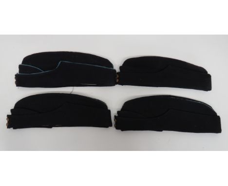 Four Coloured British Field Service Capsconsisting 3 x dark blue examples with light blue crown piping ... Similar example wi