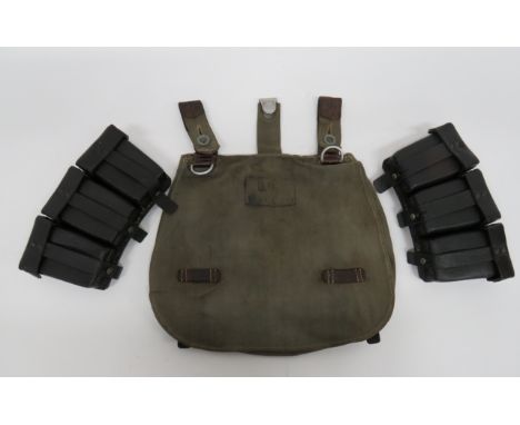 Third Reich German Ammunition Pouchespair of black, stipple finish, triple, K98 ammunition pouches.  Top flaps secured by lea