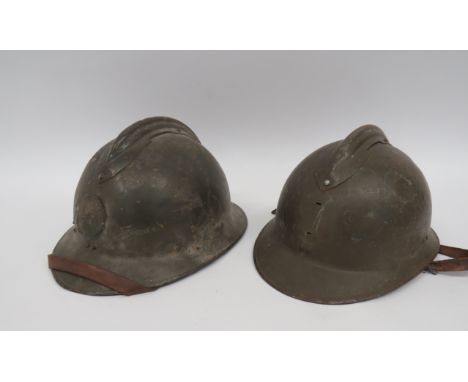 Two M1926 French Adrian Pattern Steel Helmetsgreen painted crown.  Attached top comb.  Pressed, one piece peak and rear brim.