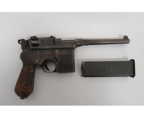 Deactivated Mauser C96 Schnellfeuer Auto Pistol7.63 mm, 5 inch barrel with blade sight.  Blackened top body with ladder sight