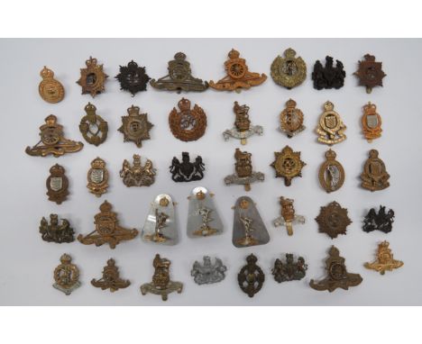Selection of Corps Cap Badgesincluding KC brass REME ... KC brass RAOC ... KC, 2 part, Royal Signals ... KC, plastic economy,
