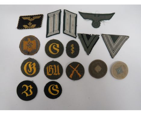 Selection of Various German Badgesincluding bevo weave Army chest eagle and swastika ... Pair of alloy embroidery Officer col