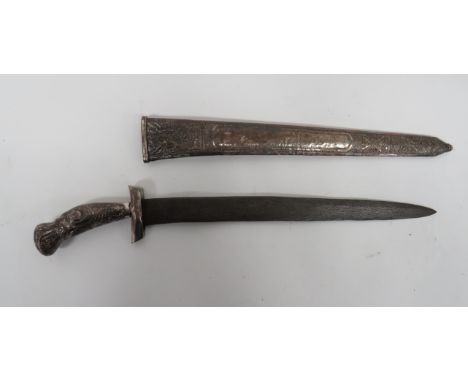 Unusual 19th Century Kris13 1/2 inch, single edged, Damascus blade. Silvered sheet covered crossguard and grip with floral em