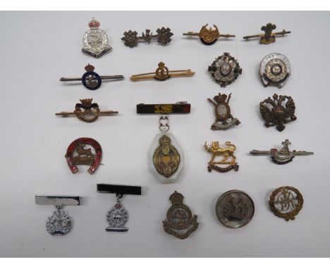 Selection of Regimental Lapel Badgesincluding silver HLI ... Gilt and enamel Herefordshire ... KC silvered and enamel Hertfor