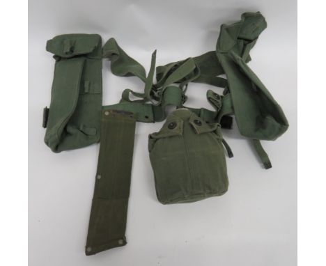 Good Part Set of 1944 Pattern Equipmentconsisting pair of  dark green webbing, ammunition pouches, both dated "1945" ... Wate