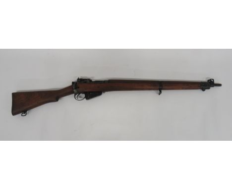 Deactivated Commonwealth No 4 Rifle.303, 25 inch barrel.  Front sight with protective ears.  Blued breech with rear mounted l