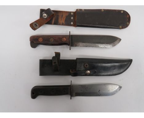 Two Current Issue Survival Knivesconsisting 7 inch, single edged example.  Blade stamped "127-8214 J. G. 2001" with broad arr