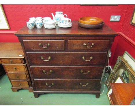 An 18th Century oak chest of two short over three graduating long drawers with brass swan neck handles over bracket feet, 110