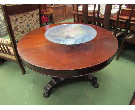 A William IV mahogany breakfast table on tripod base with carved paw feet