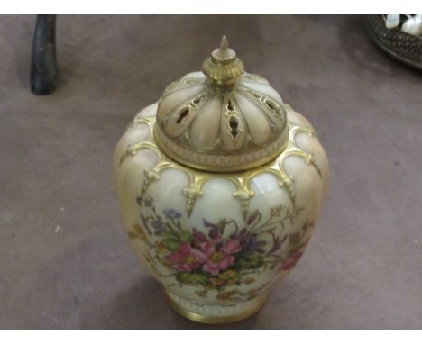 A Royal Worcester blush and gilt vase with two covers