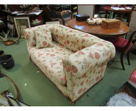 A Victorian two seater button back drop arm Chesterfield sofa on bun feet and castors (with scatter cushion) 155cm wide   